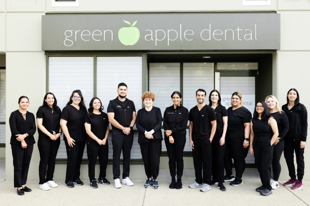 The Green Apple Dental team outside the clinic